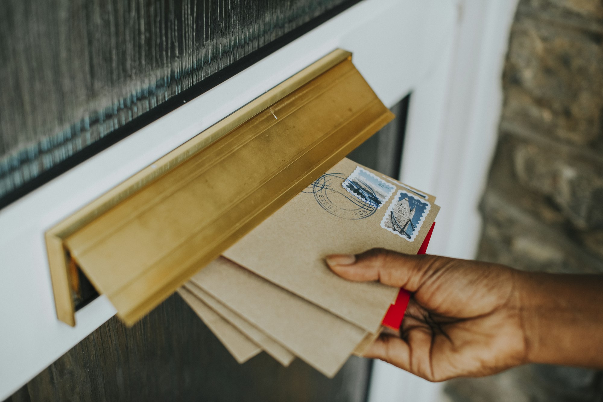 Woman picking up the mail